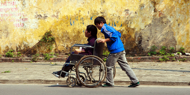 web3-helping-people-boys-pushing-push-wheelchair-disabled-shutterstock_168063155-john-bill-ai